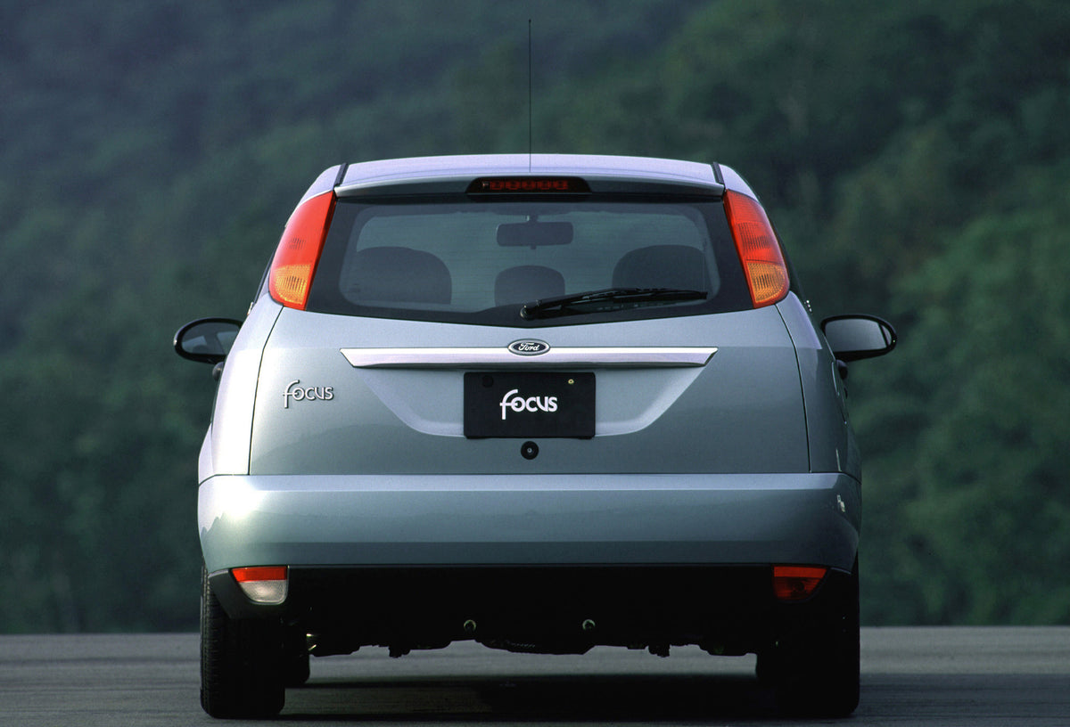 This archival image documents the 2001 Ford Focus Ghia rear view with scenic trees MS655601 and is preserved in the Ford Heritage Vault as part of Ford Motor Company's historic photographic archive. Free for personal, non-commercial use. Ford Heri...