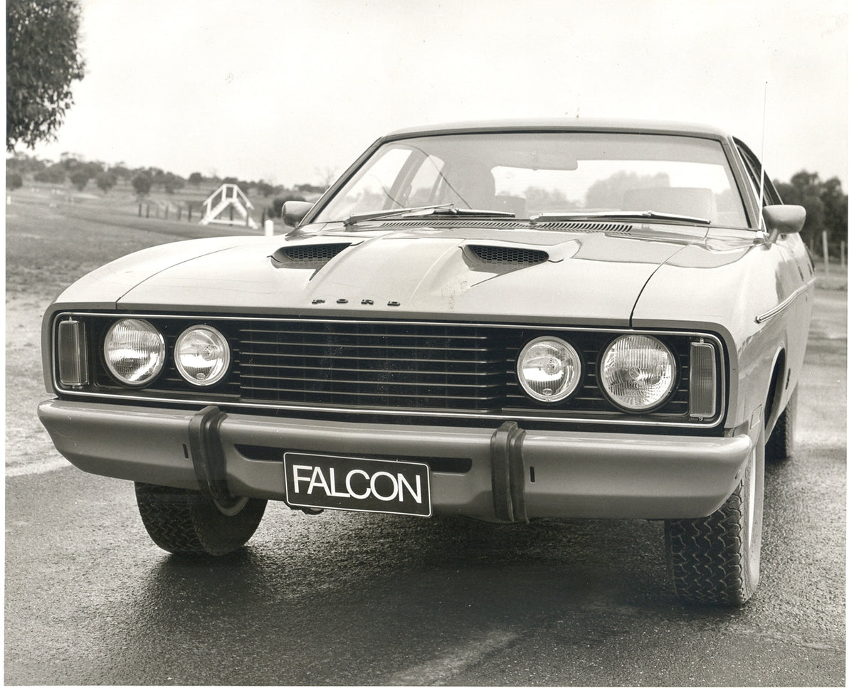This archival image documents the 1976 Ford XC Falcon front closeup on scenic road and is preserved in the Ford Heritage Vault as part of Ford Motor Company's historic photographic archive. Free for personal, non-commercial use. Ford Heritage Vaul...