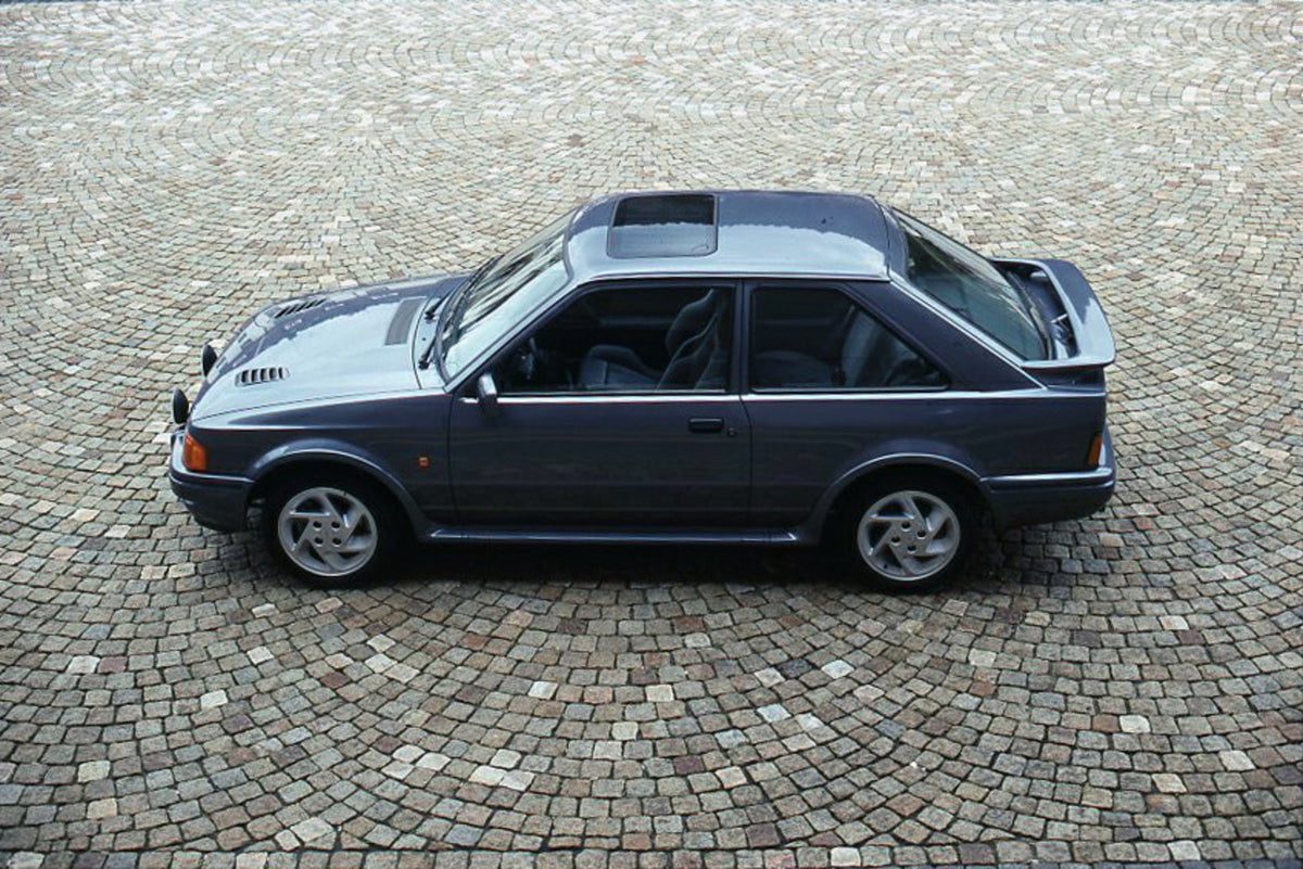 This archival image documents the 1989 Heritage Archive - 1988 Ford Escort Mark IV side view on mosaic brick and is preserved in the Ford Heritage Vault as part of Ford Motor Company's historic photographic archive. Free for personal, non-commerci...