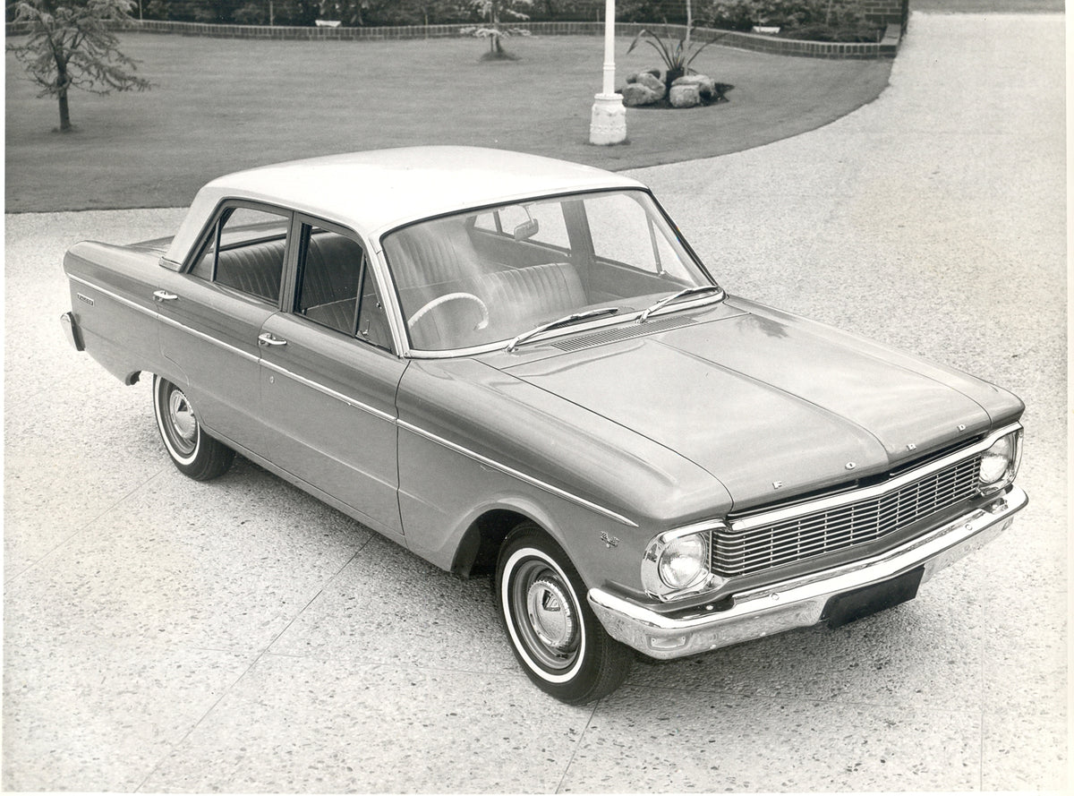 This archival image documents the 1965 Ford XP Falcon in scenic driveway and is preserved in the Ford Heritage Vault as part of Ford Motor Company's historic photographic archive. Free for personal, non-commercial use. Ford Heritage Vault referenc...