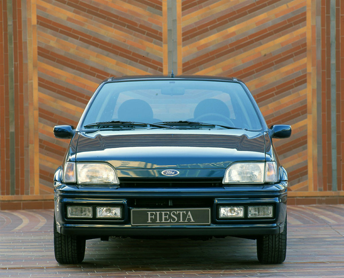 This archival image documents the 1994 1/2 Ford Fiesta Mark III front view in front of scenic brick mosaic in Cannes and is preserved in the Ford Heritage Vault as part of Ford Motor Company's historic photographic archive. Free for personal, non-...