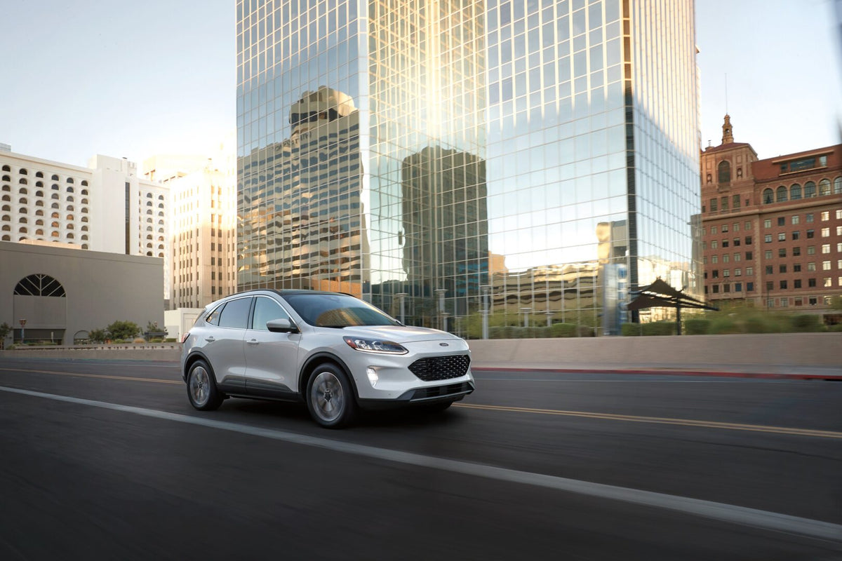 This archival image documents the 2022 Ford Escape SE Sport action shot in city and is preserved in the Ford Heritage Vault as part of Ford Motor Company's historic photographic archive. Free for personal, non-commercial use. Ford Heritage Vault r...