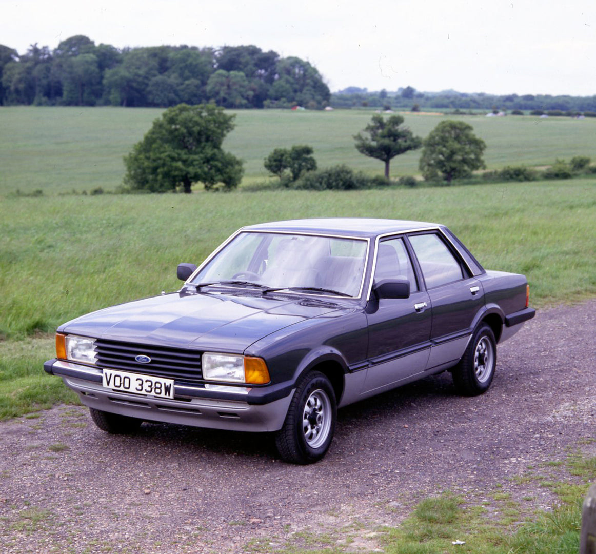 This archival image documents the 1981 Ford Cortina Carousel on scenic road with field and trees and is preserved in the Ford Heritage Vault as part of Ford Motor Company's historic photographic archive. Free for personal, non-commercial use. Ford...
