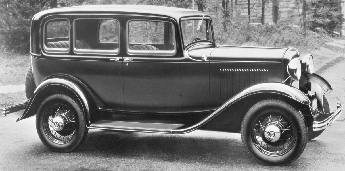 This archival image documents the 1932 Ford DeLuxe Fordor Sedan and is preserved in the Ford Heritage Vault as part of Ford Motor Company's historic photographic archive. Free for personal, non-commercial use. Ford Heritage Vault reference AR-2008...