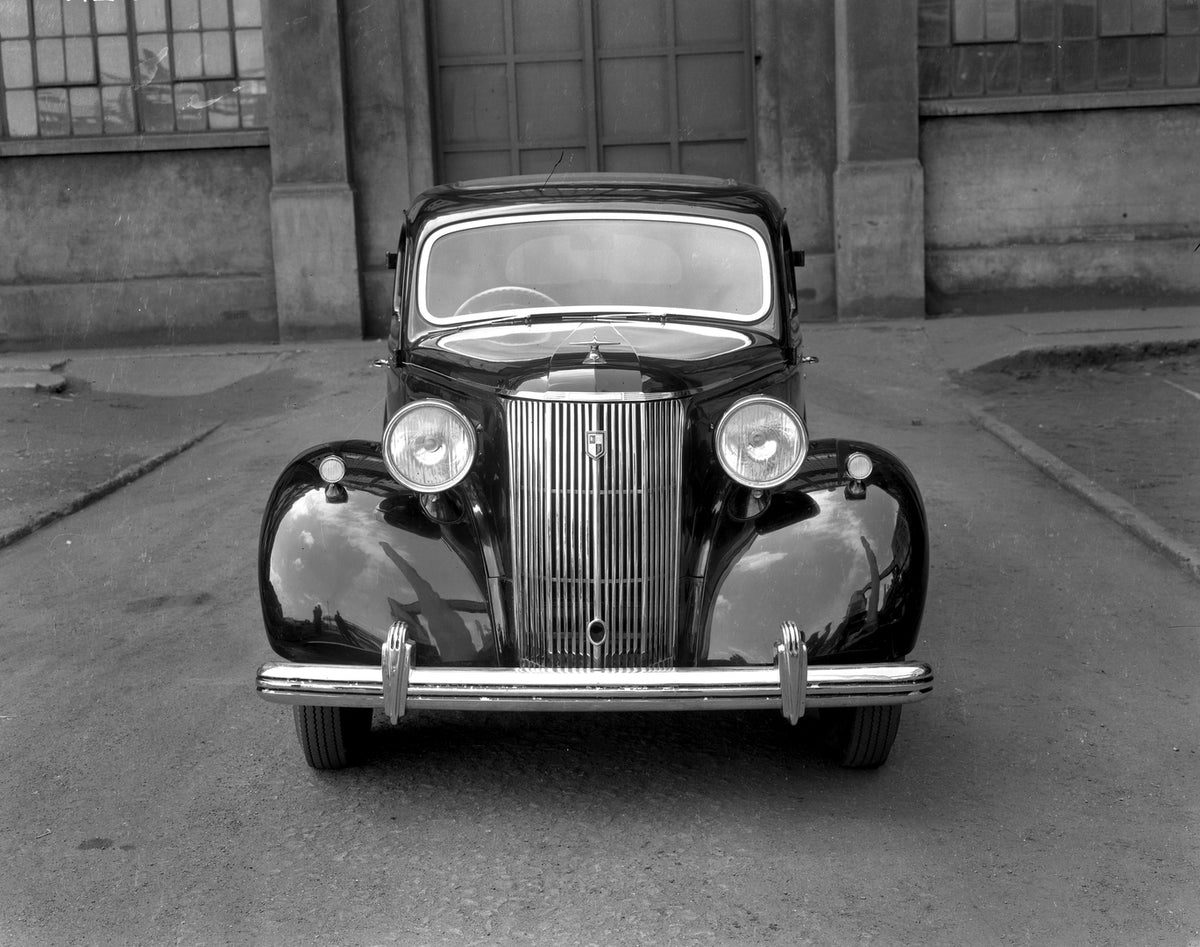 This archival image documents the 1947 Ford Pilot front view in front of building 18E 20 and is preserved in the Ford Heritage Vault as part of Ford Motor Company's historic photographic archive. Free for personal, non-commercial use. Ford Heritag...