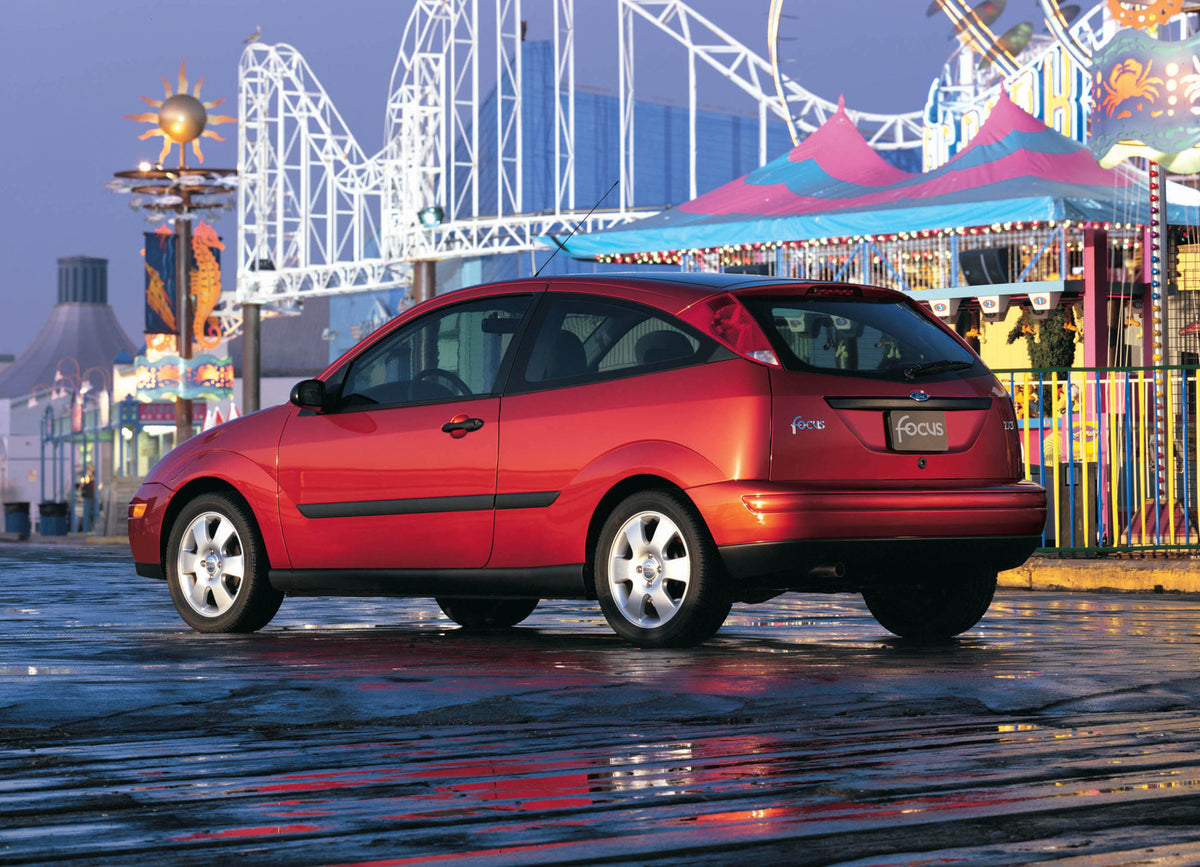 This archival image documents the 2002 Ford Focus rear view at carnival MS3769 and is preserved in the Ford Heritage Vault as part of Ford Motor Company's historic photographic archive. Free for personal, non-commercial use. Ford Heritage Vault re...