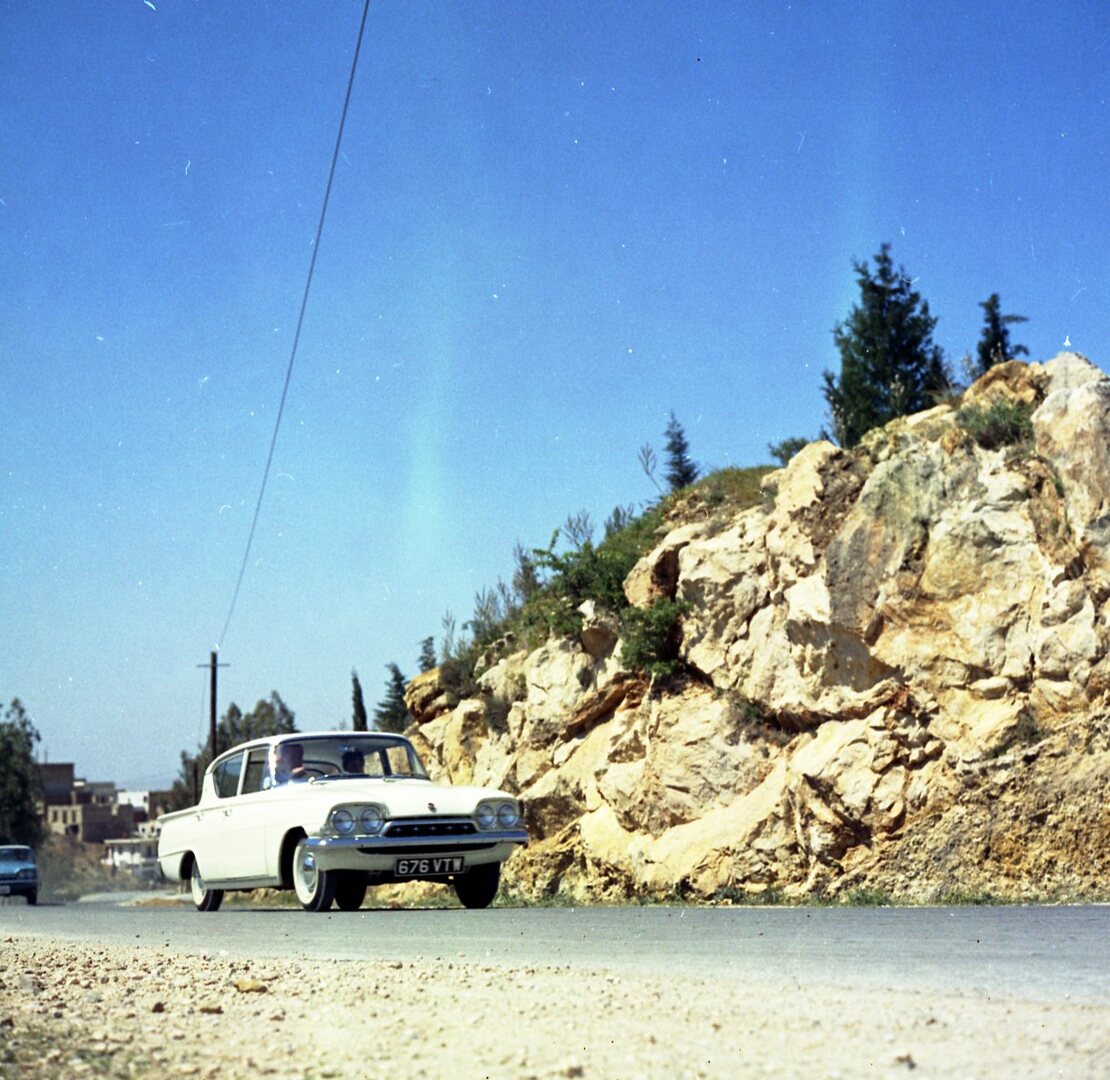 This archival image documents the 1961 Ford Classic and Consul 315 on scenic road in Greece and is preserved in the Ford Heritage Vault as part of Ford Motor Company's historic photographic archive. Free for personal, non-commercial use. Ford Heri...