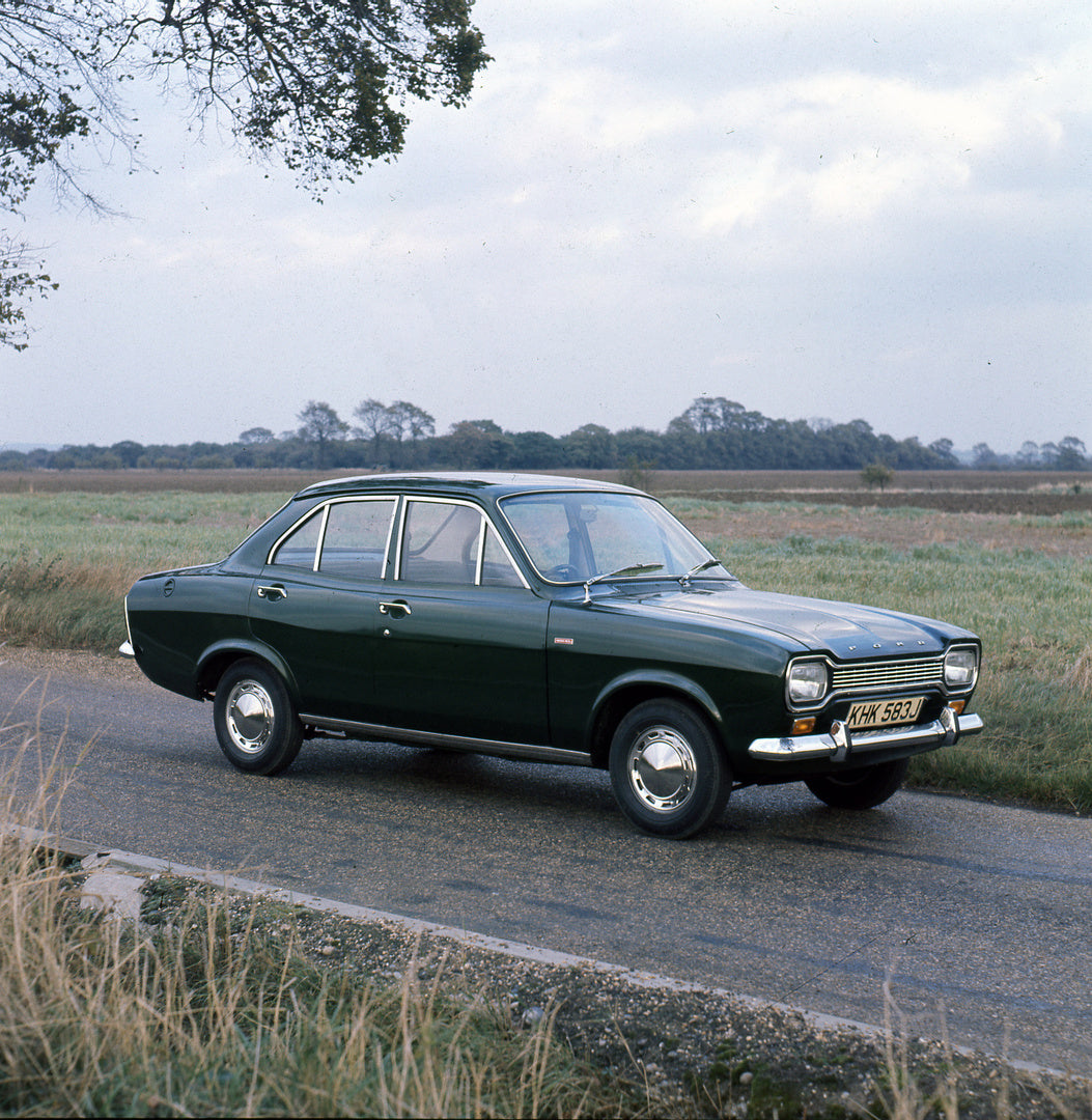 This archival image documents the 1970 Ford Escort Mark I 4 Door 1300 XL on scenic road and is preserved in the Ford Heritage Vault as part of Ford Motor Company's historic photographic archive. Free for personal, non-commercial use. Ford Heritage...