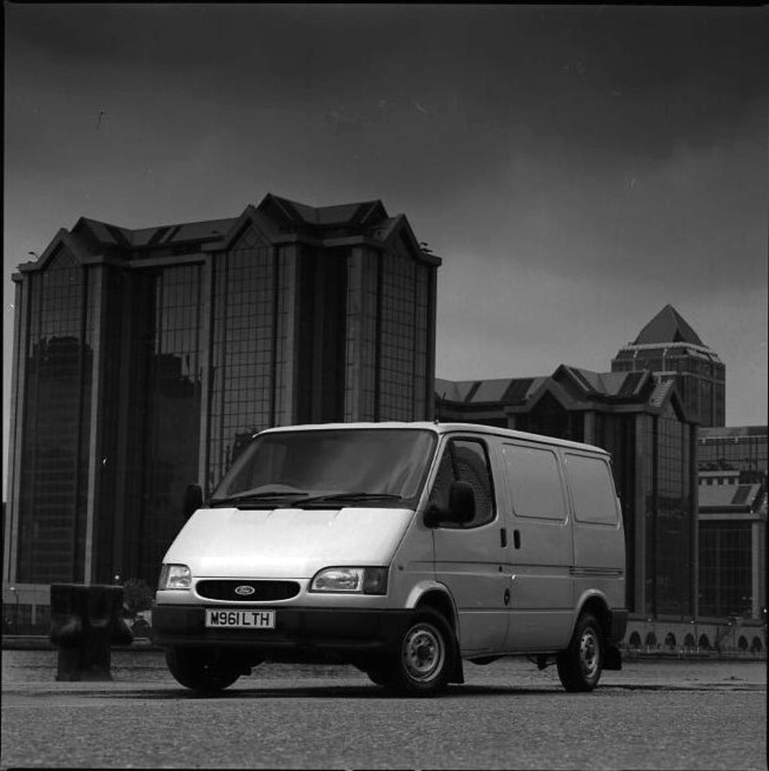 This archival image documents the 1994 Ford Transit Mark III with scenic buildings and is preserved in the Ford Heritage Vault as part of Ford Motor Company's historic photographic archive. Free for personal, non-commercial use. Ford Heritage Vaul...