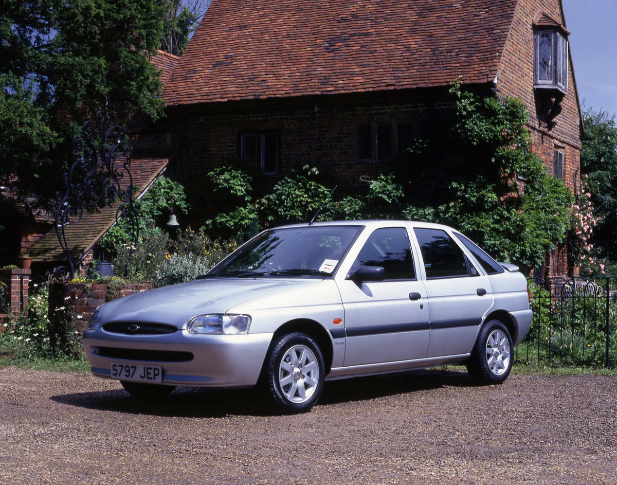 This archival image documents the 1998 Ford Escort Mark VI Finesse in front of scenic building and is preserved in the Ford Heritage Vault as part of Ford Motor Company's historic photographic archive. Free for personal, non-commercial use. Ford H...