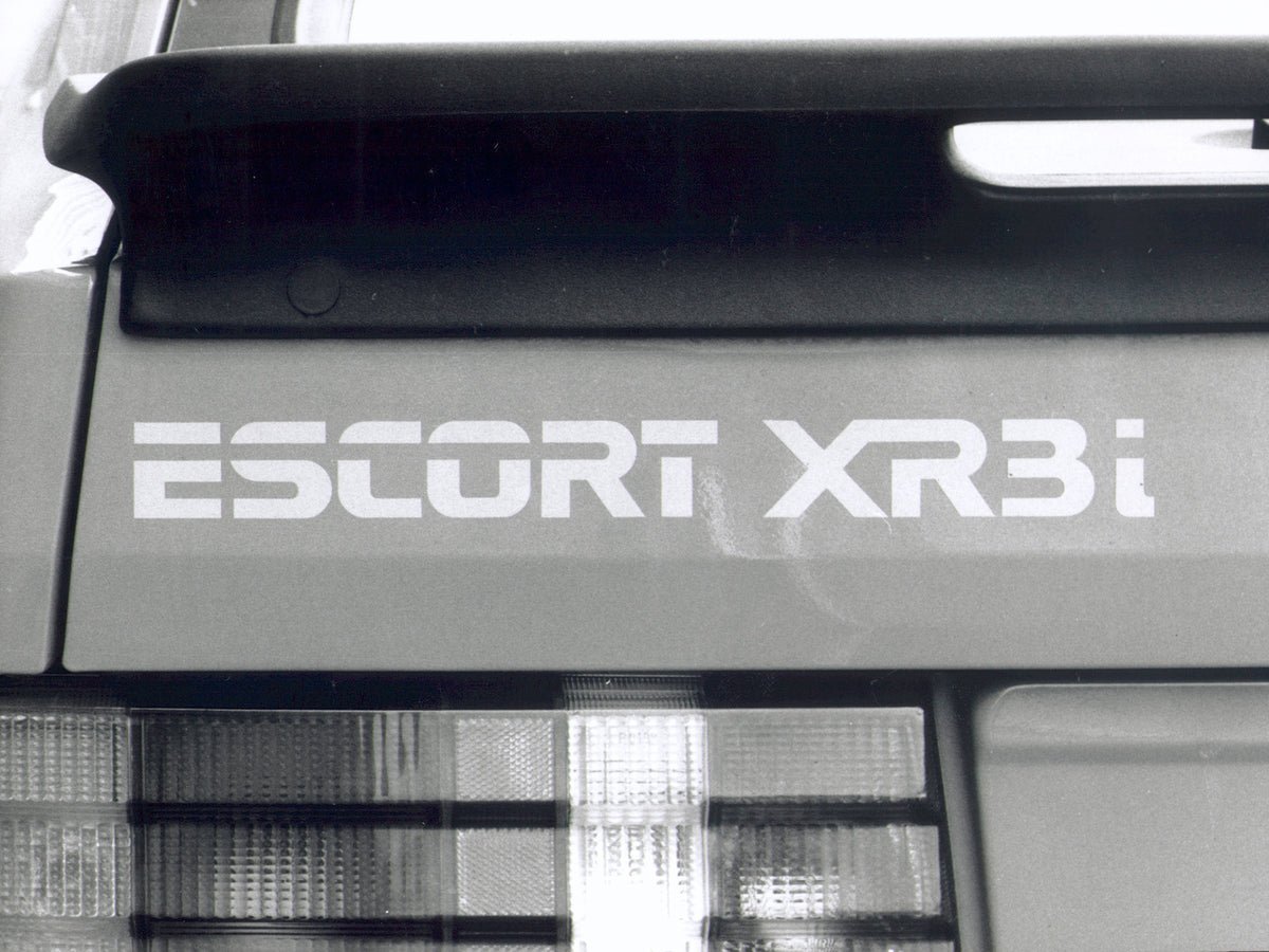 This archival image documents the 1982 Ford Escort Mark III taillight and badge closeup and is preserved in the Ford Heritage Vault as part of Ford Motor Company's historic photographic archive. Free for personal, non-commercial use. Ford Heritage...