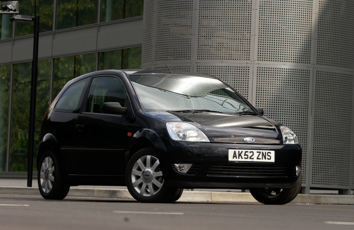 This archival image documents the 2003 Ford Fiesta Mark VI closeup in front of scenic building and is preserved in the Ford Heritage Vault as part of Ford Motor Company's historic photographic archive. Free for personal, non-commercial use. Ford H...