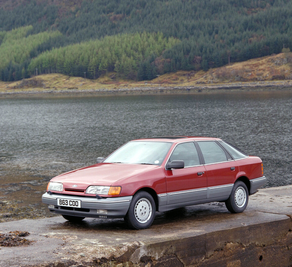 This archival image documents the 1985 Ford Scorpio Mark I near scenic lake with forest and is preserved in the Ford Heritage Vault as part of Ford Motor Company's historic photographic archive. Free for personal, non-commercial use. Ford Heritage...