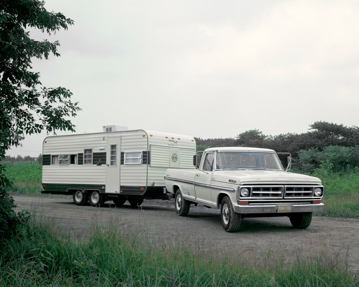 This archival image documents the 1971 Ford F-250 Ranger XLT pickup truck towing camper and is preserved in the Ford Heritage Vault as part of Ford Motor Company's historic photographic archive. Free for personal, non-commercial use. Ford Heritage...