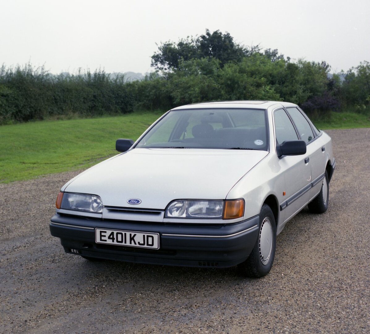 This archival image documents the 1987 Ford Granada Mark III GL front view on scenic road and is preserved in the Ford Heritage Vault as part of Ford Motor Company's historic photographic archive. Free for personal, non-commercial use. Ford Herita...