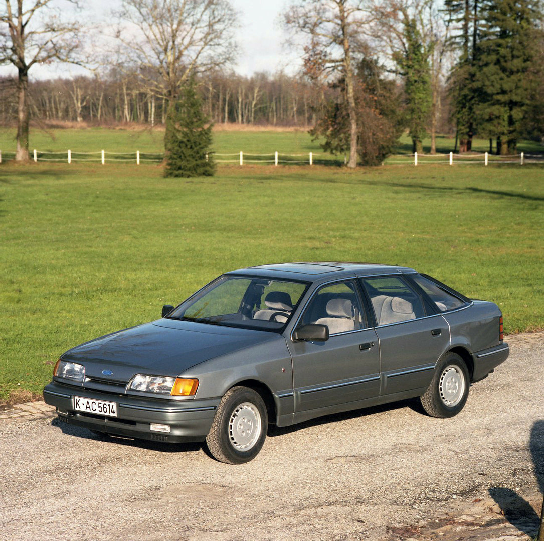 This archival image documents the 1984 Ford Scorpio Mark I LHD in driveway with trees in Bordeaux and is preserved in the Ford Heritage Vault as part of Ford Motor Company's historic photographic archive. Free for personal, non-commercial use. For...