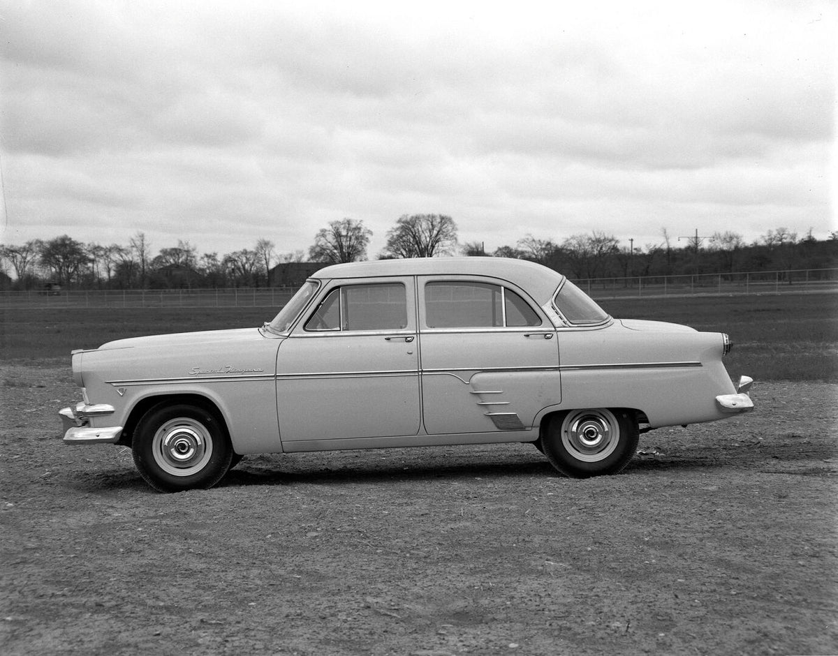 This archival image documents the 1954 Meteor Niagara Sedan side view on dirt road with scenic trees AR-2007-5 and is preserved in the Ford Heritage Vault as part of Ford Motor Company's historic photographic archive. Free for personal, non-commer...