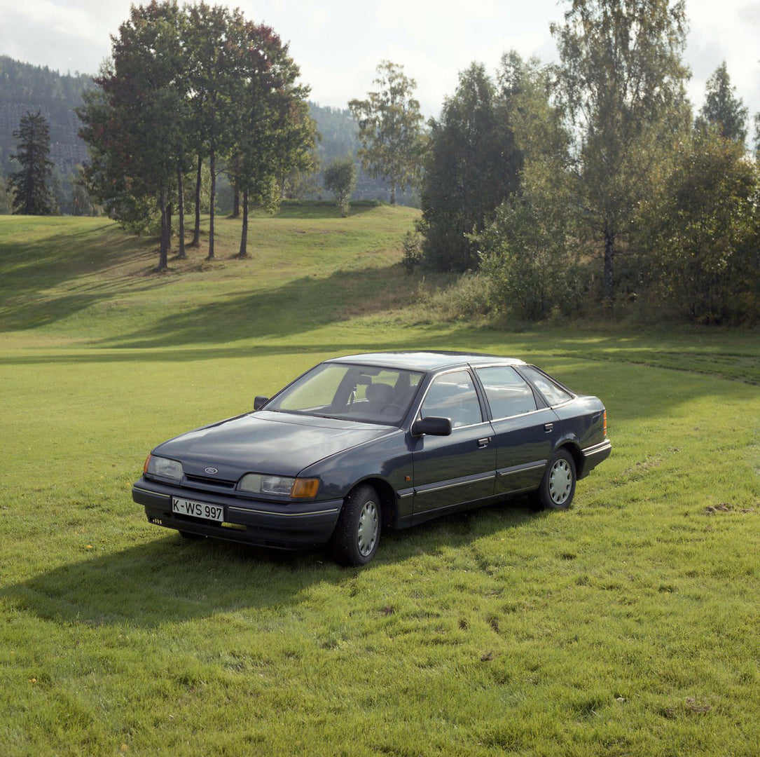 This archival image documents the 1984 Ford Scorpio Mark I GL LHD in scenic field with trees in Norway and is preserved in the Ford Heritage Vault as part of Ford Motor Company's historic photographic archive. Free for personal, non-commercial use...