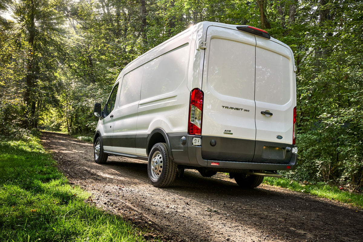 This archival image documents the 2021 Ford Transit rear view on scenic road MS and is preserved in the Ford Heritage Vault as part of Ford Motor Company's historic photographic archive. Free for personal, non-commercial use. Ford Heritage Vault r...