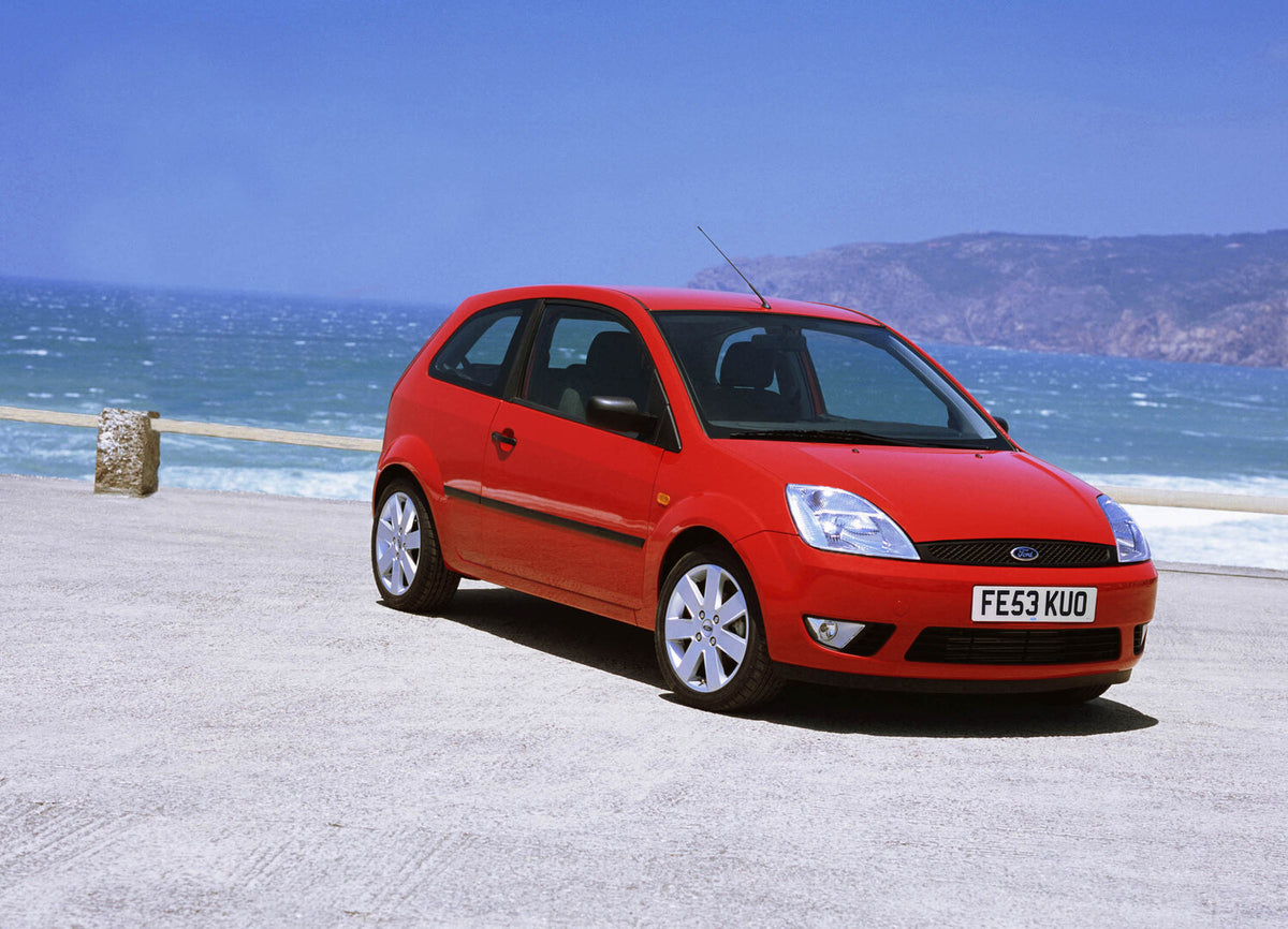This archival image documents the 2003 Ford Fiesta Mark VI near scenic beach and is preserved in the Ford Heritage Vault as part of Ford Motor Company's historic photographic archive. Free for personal, non-commercial use. Ford Heritage Vault refe...