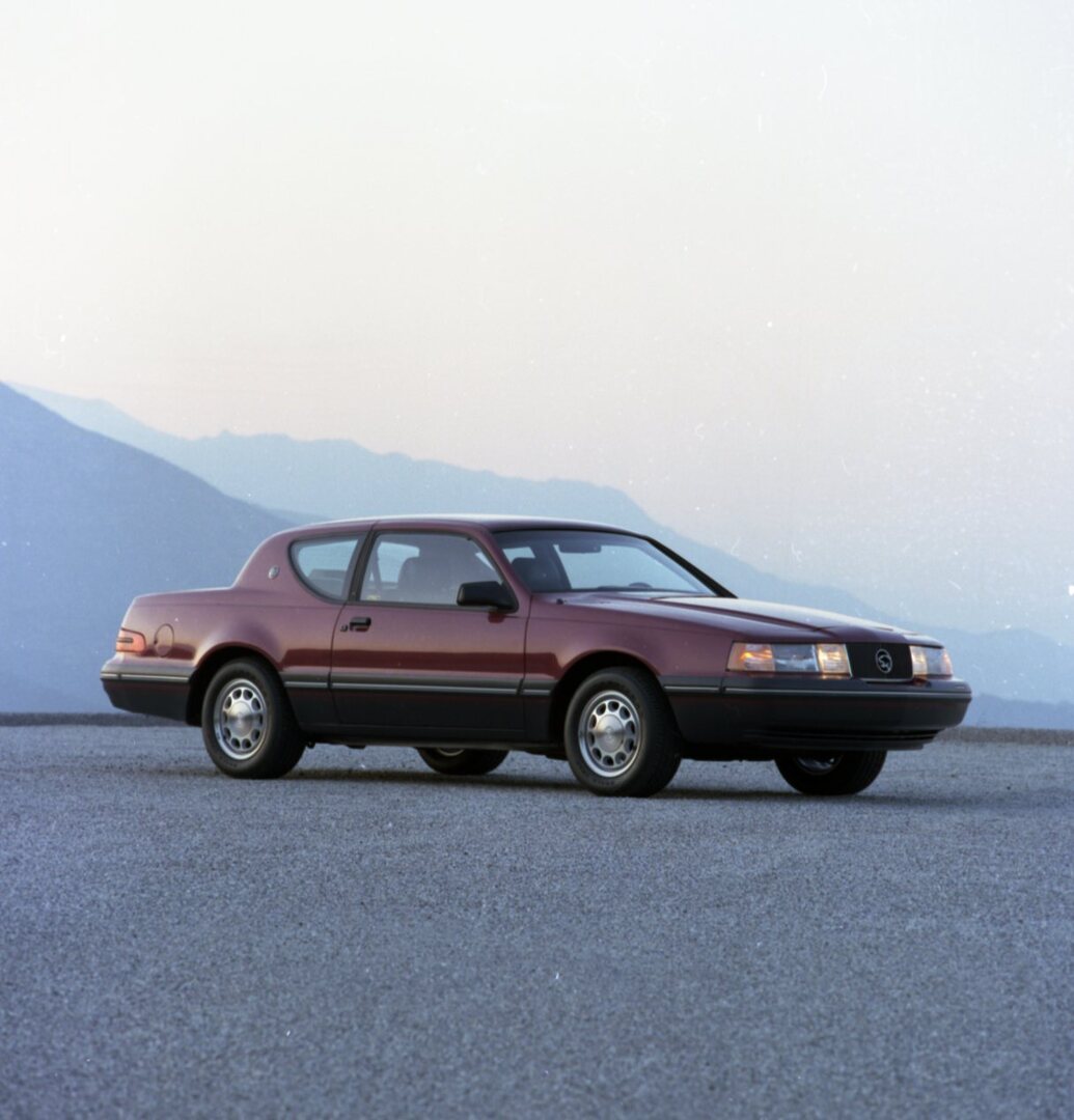 This archival image documents the 1987 Mercury Cougar side view in front of mountains CN45012-075002 and is preserved in the Ford Heritage Vault as part of Ford Motor Company's historic photographic archive. Free for personal, non-commercial use. ...
