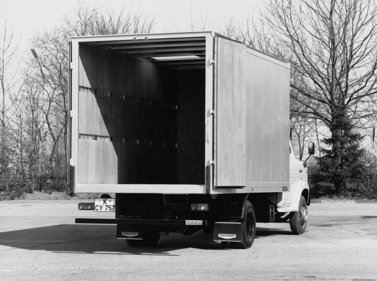 This archival image documents the 1970 Ford A-Series Truck rear view with open back near scenic trees and is preserved in the Ford Heritage Vault as part of Ford Motor Company's historic photographic archive. Free for personal, non-commercial use....