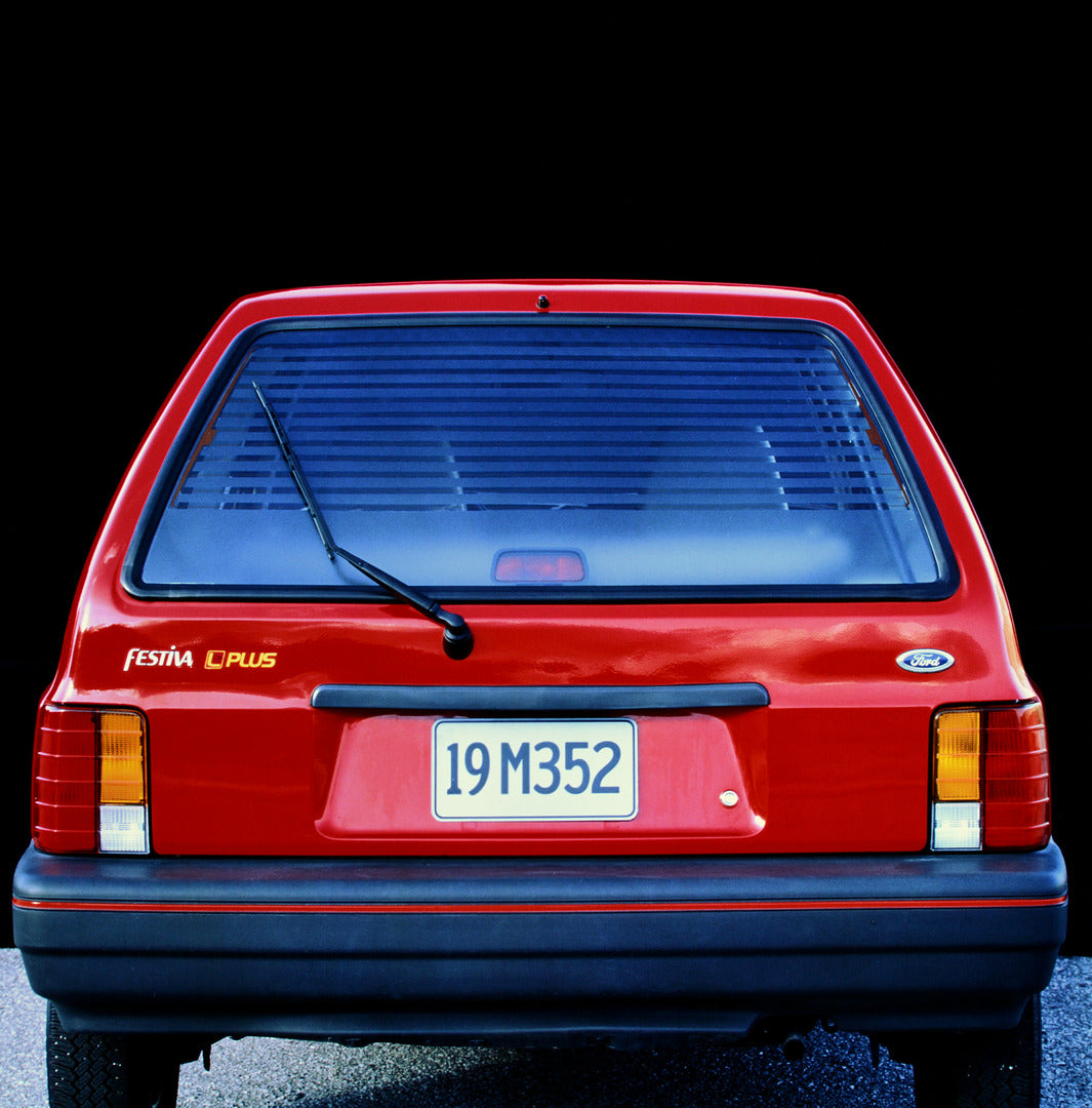 This archival image documents the 1990 Ford Festiva Plus rear window and is preserved in the Ford Heritage Vault as part of Ford Motor Company's historic photographic archive. Free for personal, non-commercial use. Ford Heritage Vault reference AR...