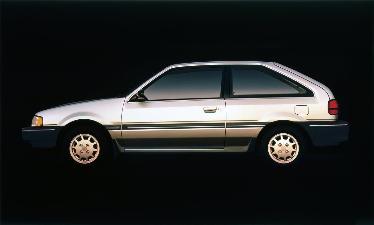This archival image documents the 1988 Mercury Tracer Three-Door and is preserved in the Ford Heritage Vault as part of Ford Motor Company's historic photographic archive. Free for personal, non-commercial use. Ford Heritage Vault reference AR-200...