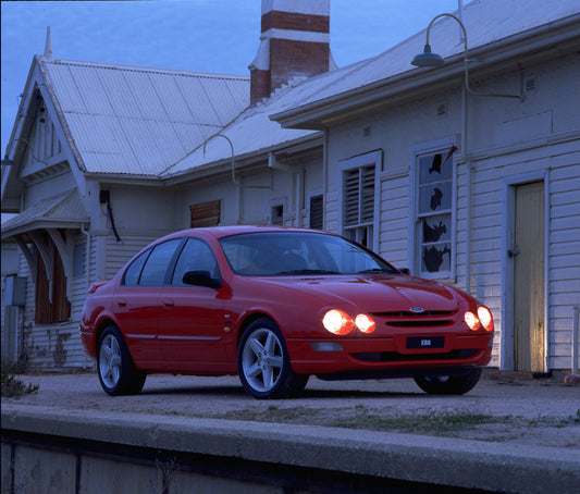 1998 Ford Falcon XR6 in front of old building with headlights on HV 1998-0080