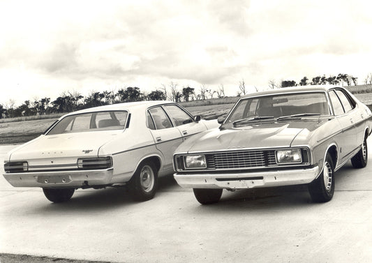 1976 Ford XC Falcons front and rear view with scenic trees HV 1976-0111