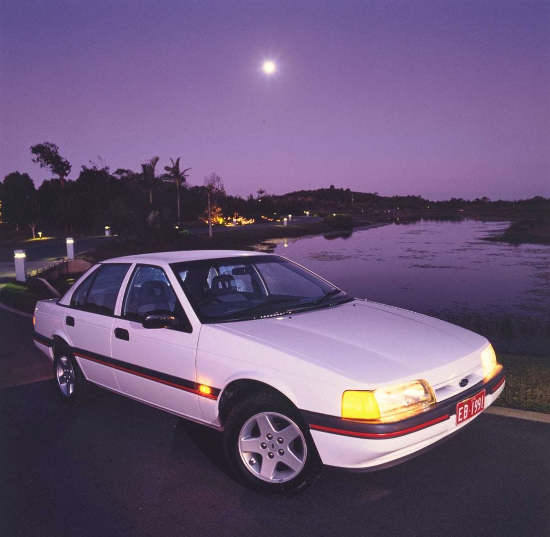 This archival image documents the 1991 Ford EB Falcon S Sedan Driver Side Front End View Parked Near Pond FAP-2011-3 and is preserved in the Ford Heritage Vault as part of Ford Motor Company's historic photographic archive. Free for personal, non-...