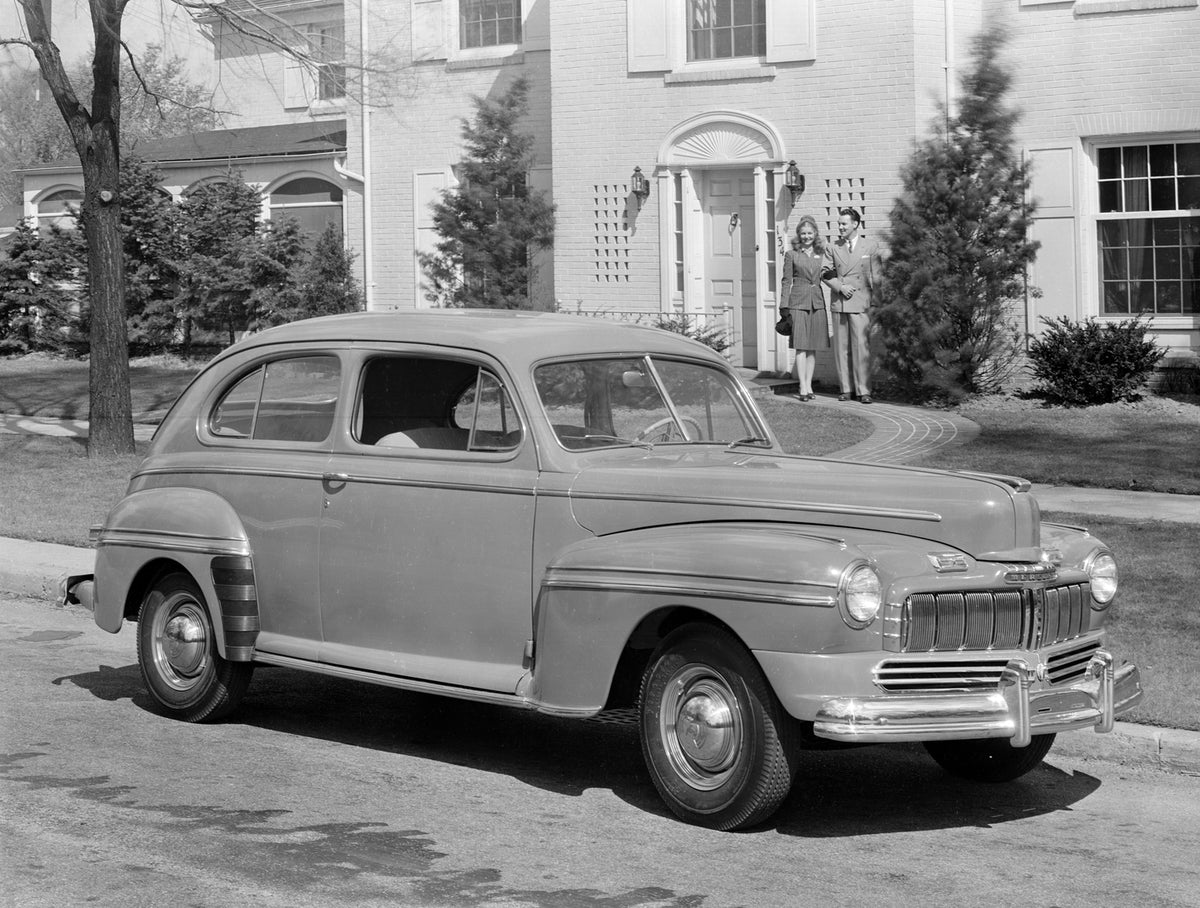 This archival image documents the 1946 Mercury Two-Door Couple In Background and is preserved in the Ford Heritage Vault as part of Ford Motor Company's historic photographic archive. Free for personal, non-commercial use. Ford Heritage Vault refe...