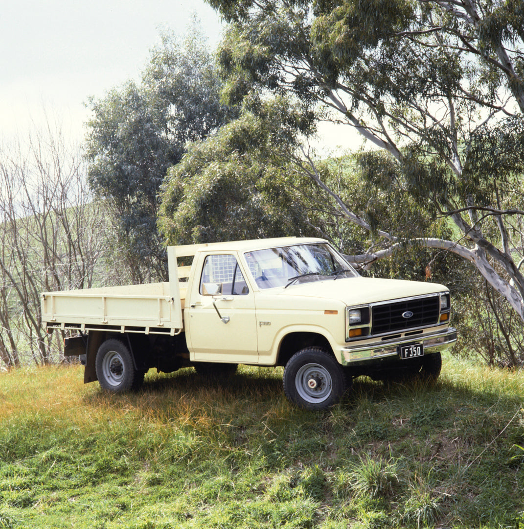 This archival image documents the 1984 Ford F-350 Pickup Truck Driver Side Front End View in Wooded Area FAP-2011-3 and is preserved in the Ford Heritage Vault as part of Ford Motor Company's historic photographic archive. Free for personal, non-c...