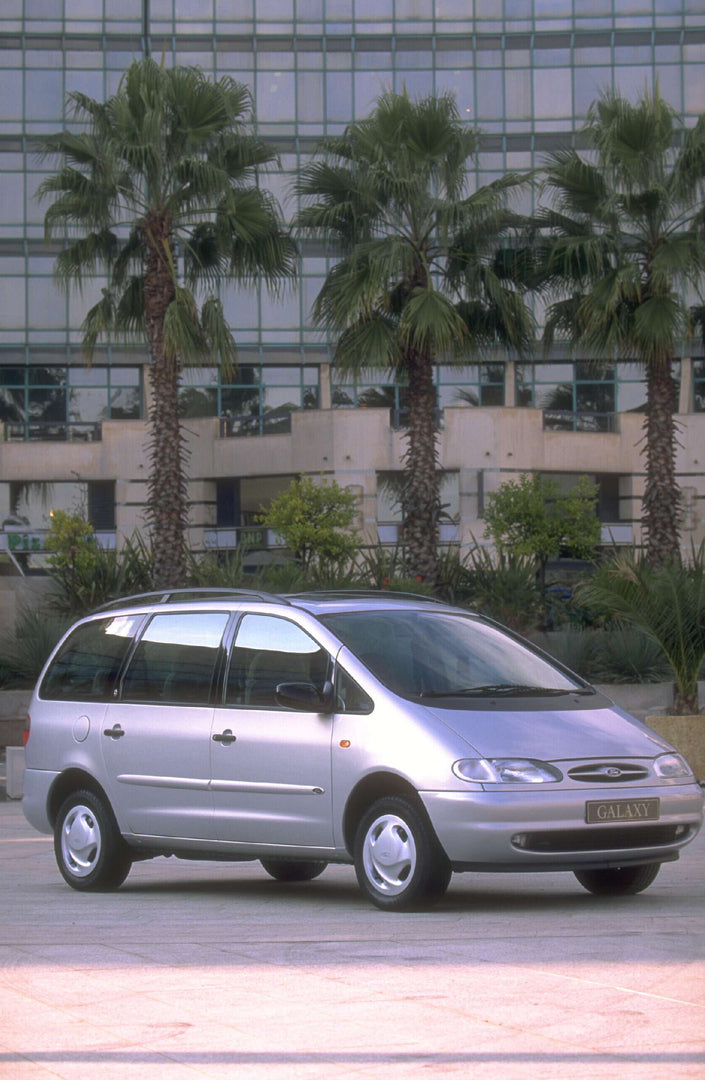 This archival image documents the 1994 Ford Galaxy Mark I Ghia in front of building with palm trees AR-2002-213709 and is preserved in the Ford Heritage Vault as part of Ford Motor Company's historic photographic archive. Free for personal, non-co...