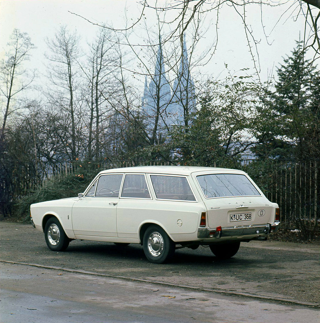 This archival image documents the 1971 Ford Taunus 20M rear view with scenic trees and is preserved in the Ford Heritage Vault as part of Ford Motor Company's historic photographic archive. Free for personal, non-commercial use. Ford Heritage Vaul...
