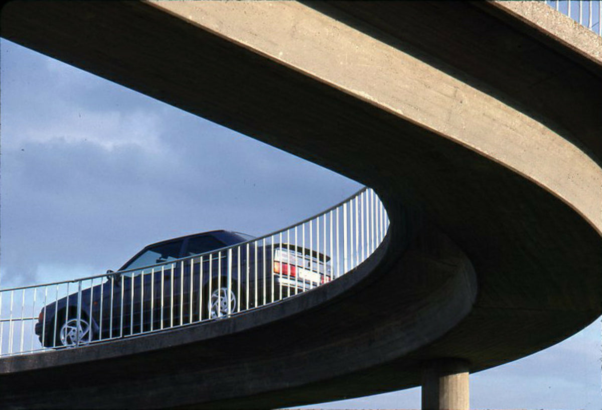 This archival image documents the 1989 Heritage Archive - 1988 Ford Escort Mark IV side view on scenic bridge and is preserved in the Ford Heritage Vault as part of Ford Motor Company's historic photographic archive. Free for personal, non-commerc...