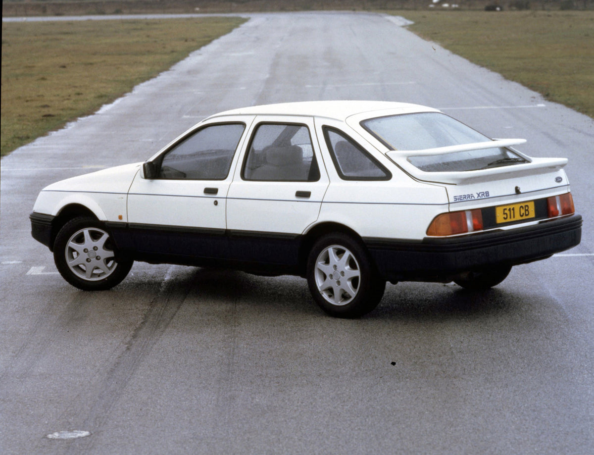 This archival image documents the 1984 Ford Sierra XR8 rear view on road and is preserved in the Ford Heritage Vault as part of Ford Motor Company's historic photographic archive. Free for personal, non-commercial use. Ford Heritage Vault referenc...