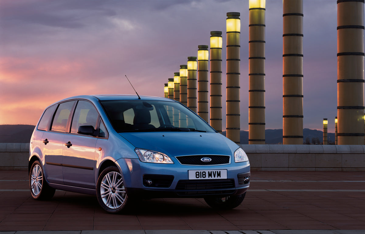 This archival image documents the 2003 Ford C-Max Mark I with scenic sunset and pillars and is preserved in the Ford Heritage Vault as part of Ford Motor Company's historic photographic archive. Free for personal, non-commercial use. Ford Heritage...
