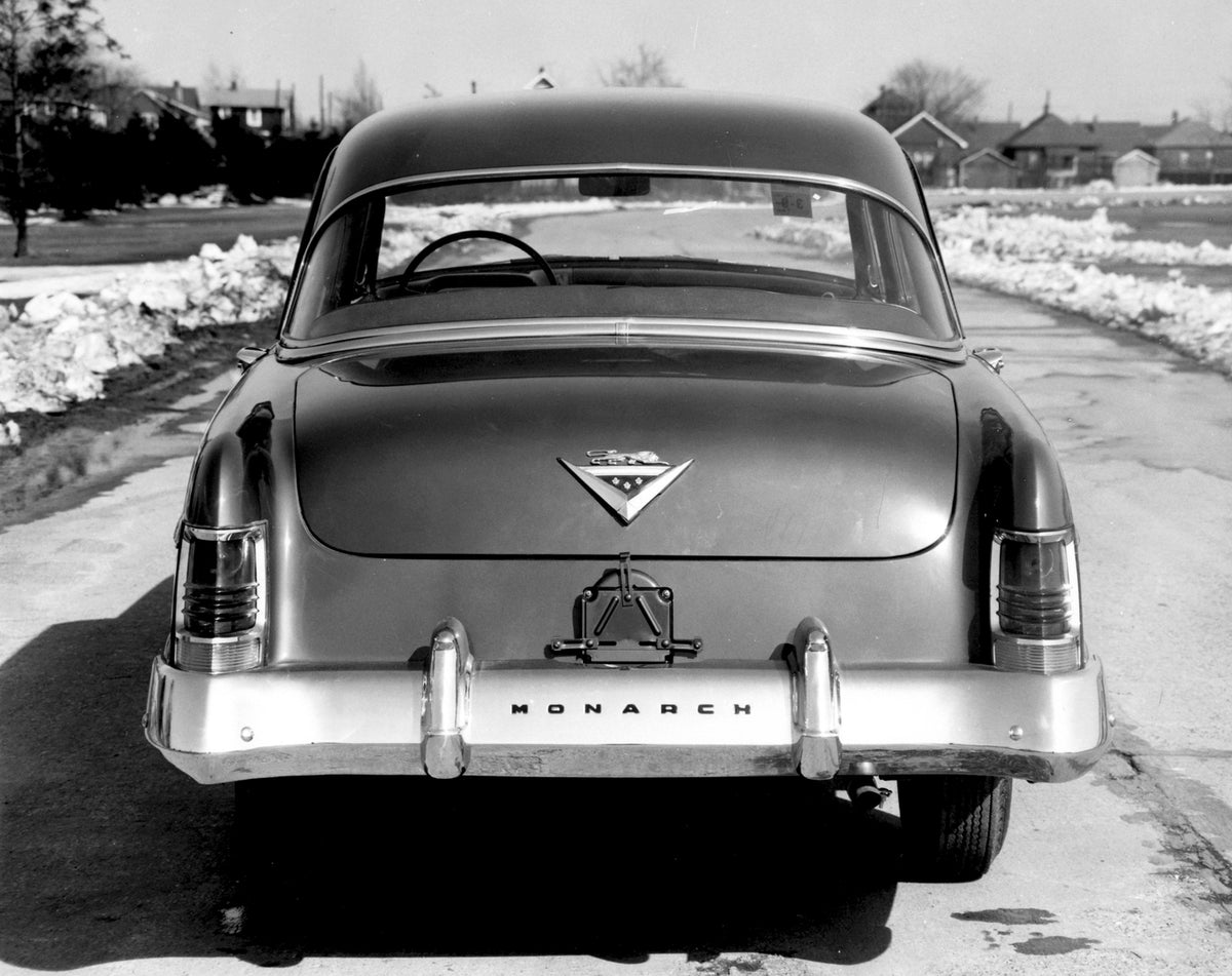 This archival image documents the 1954 Monarch Sedan rear view on scenic road AR-2007-5 and is preserved in the Ford Heritage Vault as part of Ford Motor Company's historic photographic archive. Free for personal, non-commercial use. Ford Heritage...
