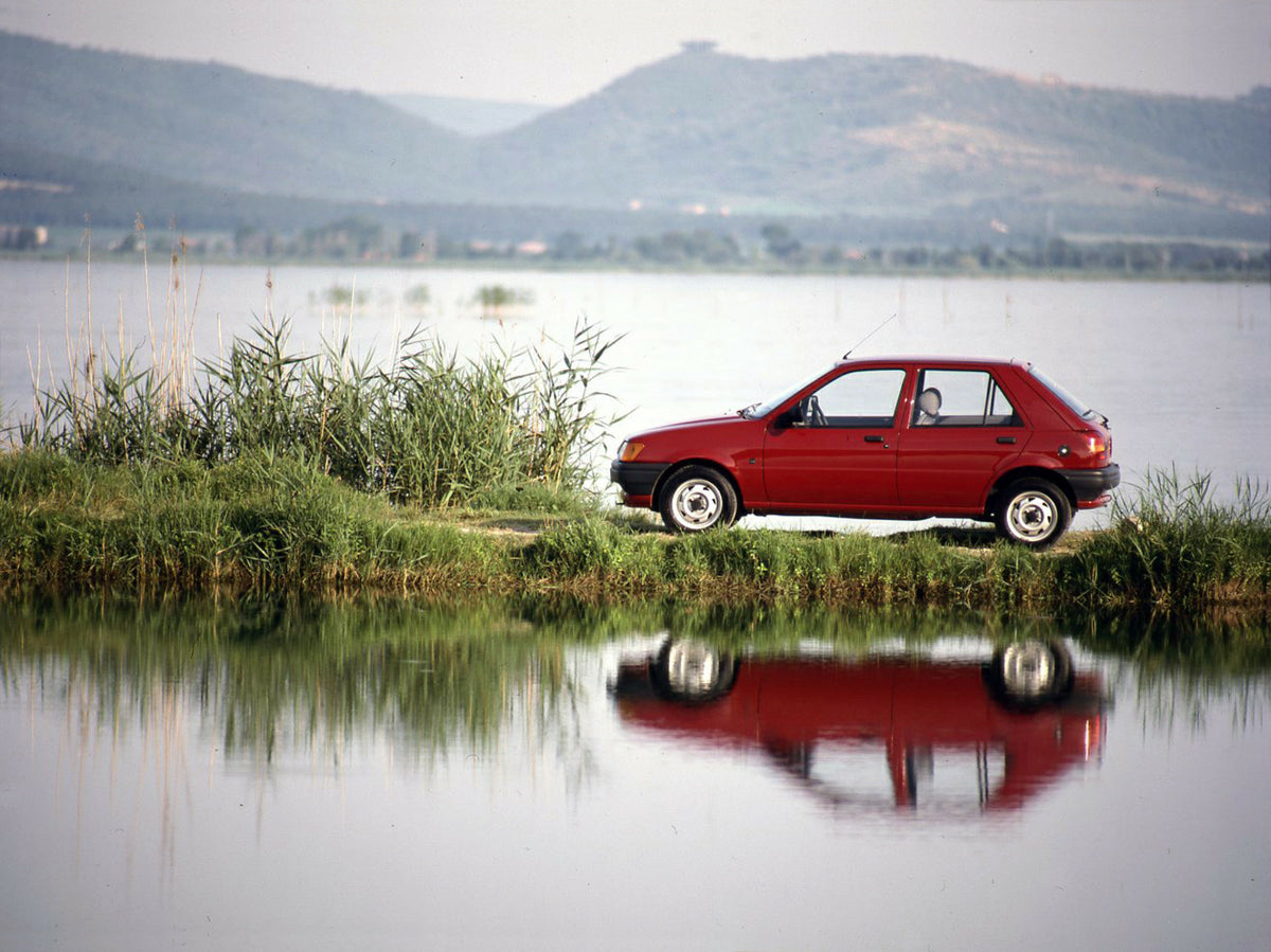 This archival image documents the 1988 Ford Fiesta Mark III LHD side view near scenic lake and is preserved in the Ford Heritage Vault as part of Ford Motor Company's historic photographic archive. Free for personal, non-commercial use. Ford Herit...