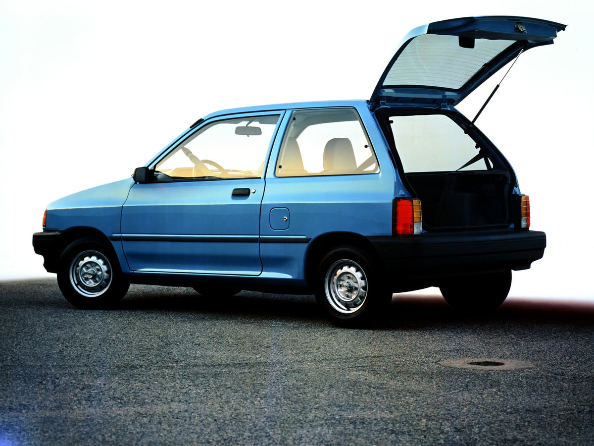 This archival image documents the 1991 Ford Festiva two-door and is preserved in the Ford Heritage Vault as part of Ford Motor Company's historic photographic archive. Free for personal, non-commercial use. Ford Heritage Vault reference AR-2001-94...