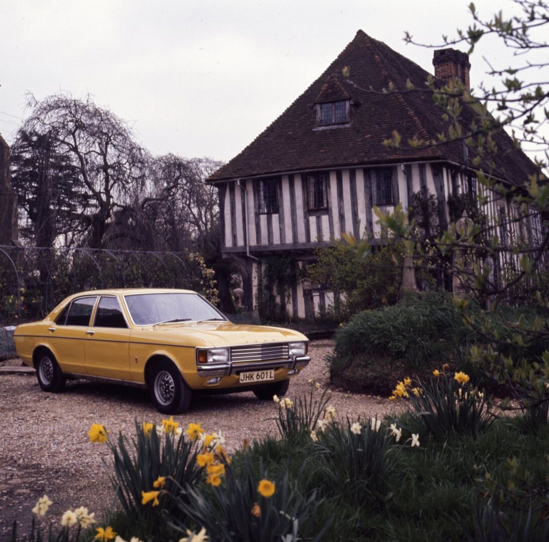 This archival image documents the 1972 Ford Granada Mark I GXL in front of scenic house with flowers and is preserved in the Ford Heritage Vault as part of Ford Motor Company's historic photographic archive. Free for personal, non-commercial use. ...