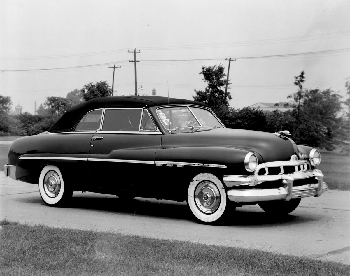 This archival image documents the 1951 Monarch Convertible on scenic road with trees AR-2007-5 and is preserved in the Ford Heritage Vault as part of Ford Motor Company's historic photographic archive. Free for personal, non-commercial use. Ford H...