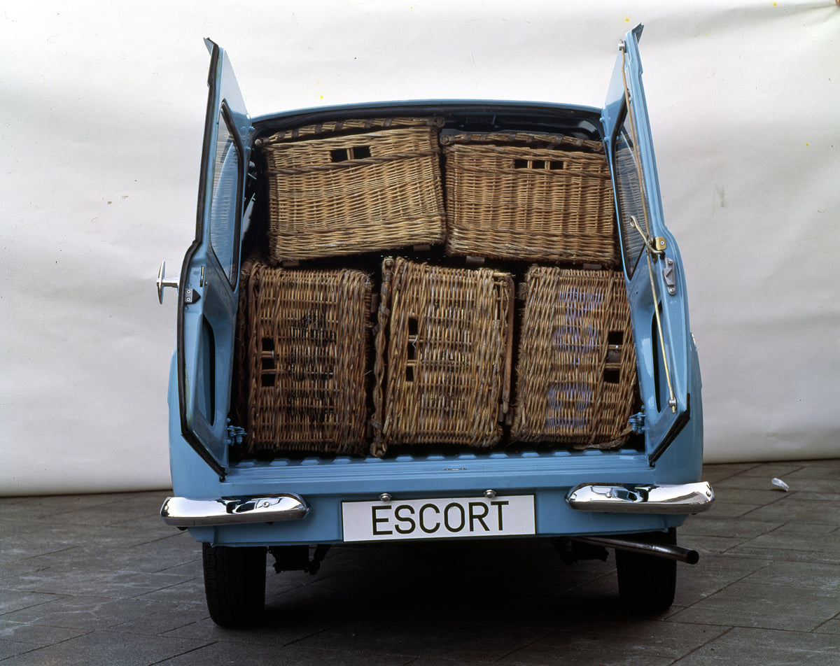 This archival image documents the 1975 Ford Escort Mark II Van rear view with baskets inside and is preserved in the Ford Heritage Vault as part of Ford Motor Company's historic photographic archive. Free for personal, non-commercial use. Ford Her...