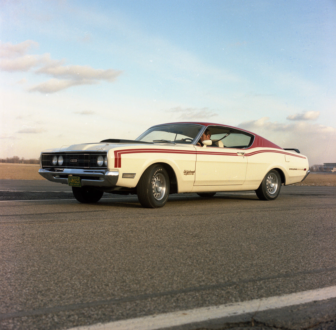 This archival image documents the 1969 Mercury Cyclone Spoiler On Road with Low Angle and Man and is preserved in the Ford Heritage Vault as part of Ford Motor Company's historic photographic archive. Free for personal, non-commercial use. Ford He...