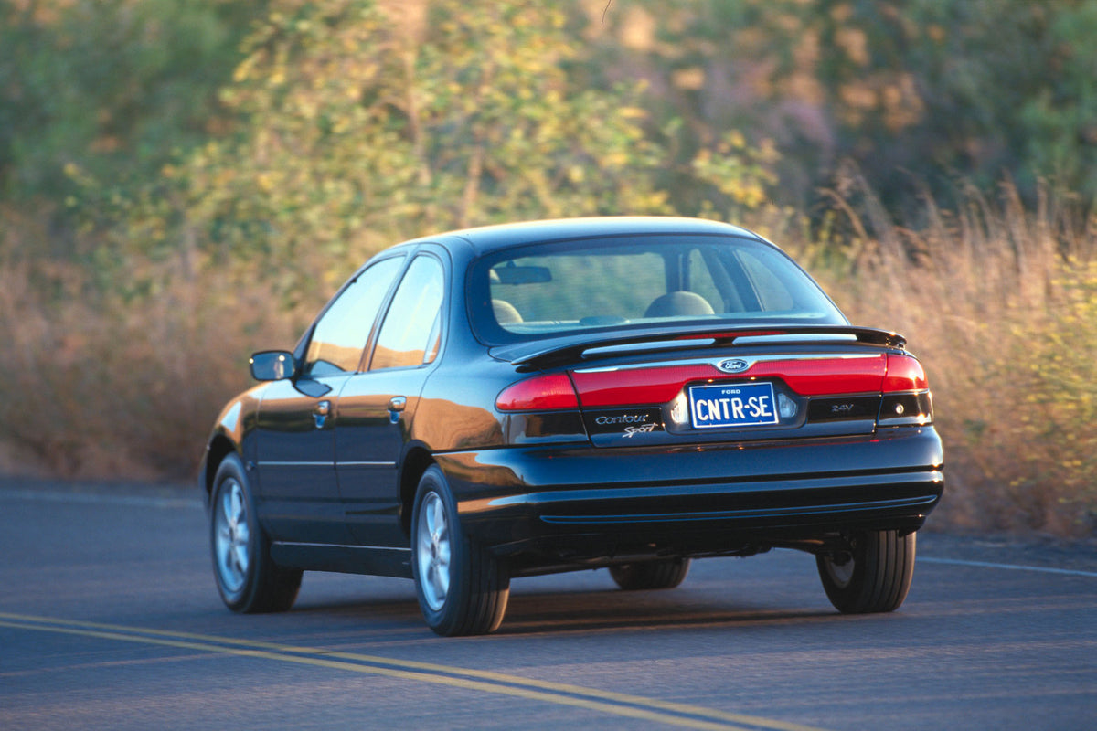 This archival image documents the 1999 Ford Contour Sport and is preserved in the Ford Heritage Vault as part of Ford Motor Company's historic photographic archive. Free for personal, non-commercial use. Ford Heritage Vault reference AR-2008-8.1.2...