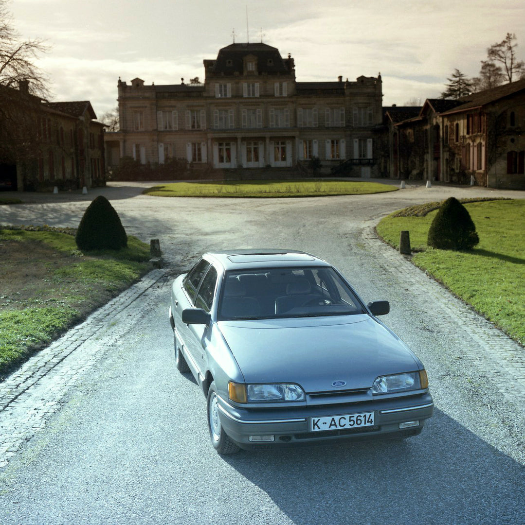 This archival image documents the 1984 Ford Scorpio Mark I LHD in front of scenic mansion in Bordeaux and is preserved in the Ford Heritage Vault as part of Ford Motor Company's historic photographic archive. Free for personal, non-commercial use....