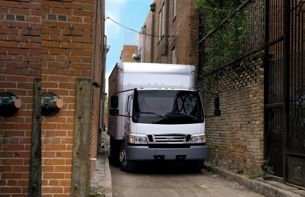 This archival image documents the 2006 Ford LCF Low Cab Forward in alley and is preserved in the Ford Heritage Vault as part of Ford Motor Company's historic photographic archive. Free for personal, non-commercial use. Ford Heritage Vault referenc...