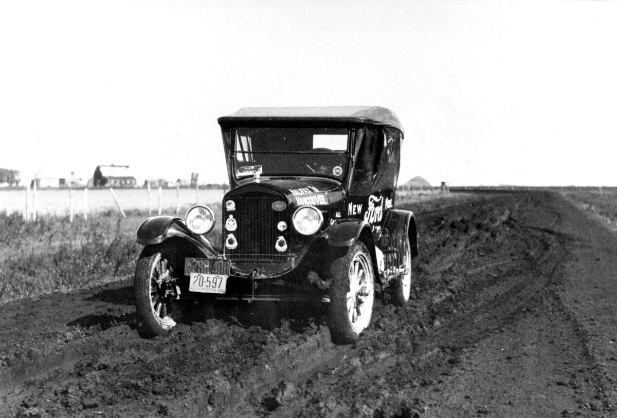 This archival image documents the 1925 Ford Model T Cross Canada Trip on Prairie Road and is preserved in the Ford Heritage Vault as part of Ford Motor Company's historic photographic archive. Free for personal, non-commercial use. Ford Heritage V...