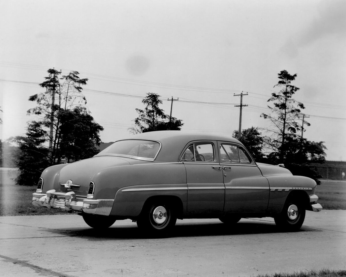 This archival image documents the 1951 Monarch Sedan rear view on scenic road with trees AR-2007-5 and is preserved in the Ford Heritage Vault as part of Ford Motor Company's historic photographic archive. Free for personal, non-commercial use. Fo...